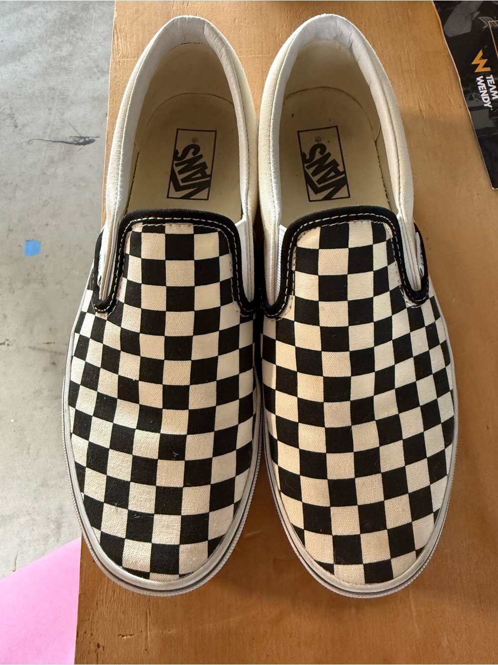 Woman’s Vans Slip-On Checkerboard Sneakers - Black and White